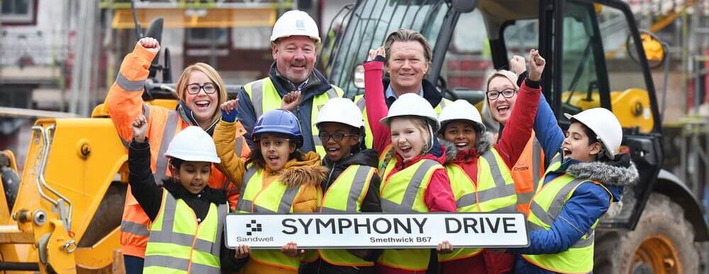School children choose name for new street being built by TC Homes.